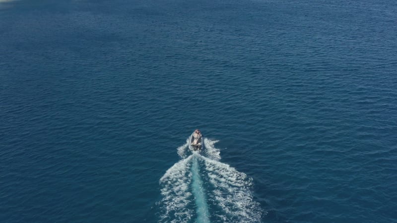 Aerial of Motorboat on Blue Ocean Exploring the Unknown