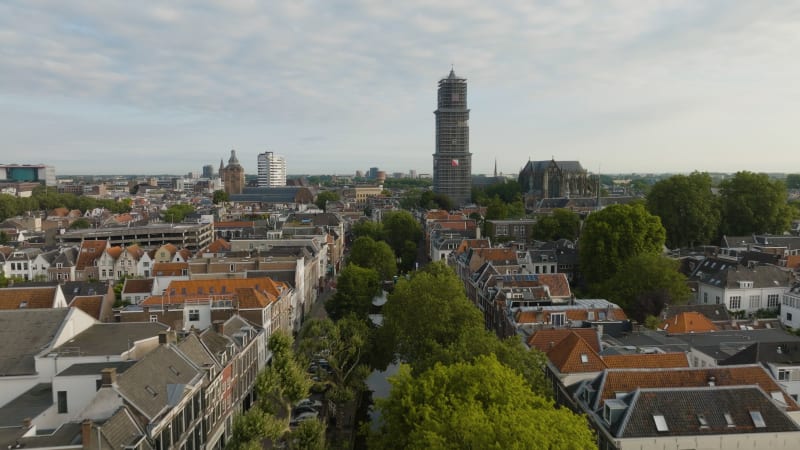 An aerial perspective captures the skyline of Utrecht. Maintenance and restoration scaffolding the majestic Dom tower in the historic city of Utrecht.