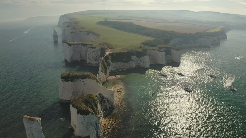 Closing in on the beach at the edge of stunning cliff rock formations