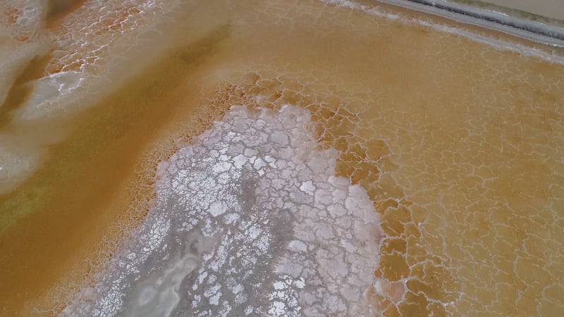 Aerial view above interesting texture pattern created by salt flats.