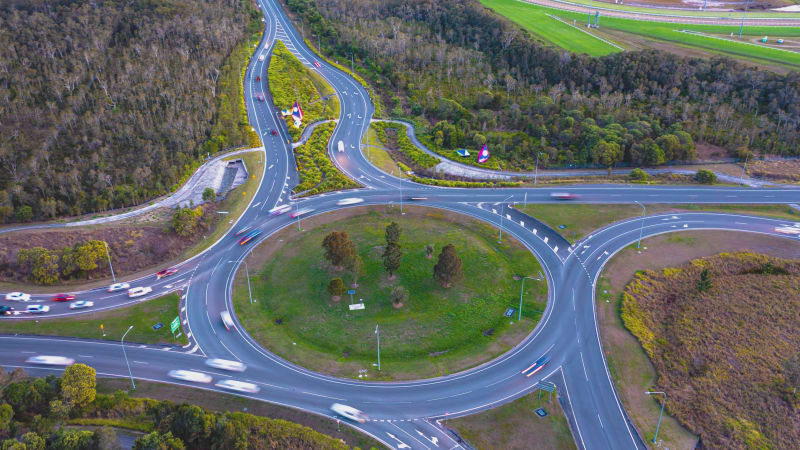 Aerial view of traffic on the Caloundra Road at Kawana Creek Arterial Road roundabout, Caloundra, Queensland, Australia.