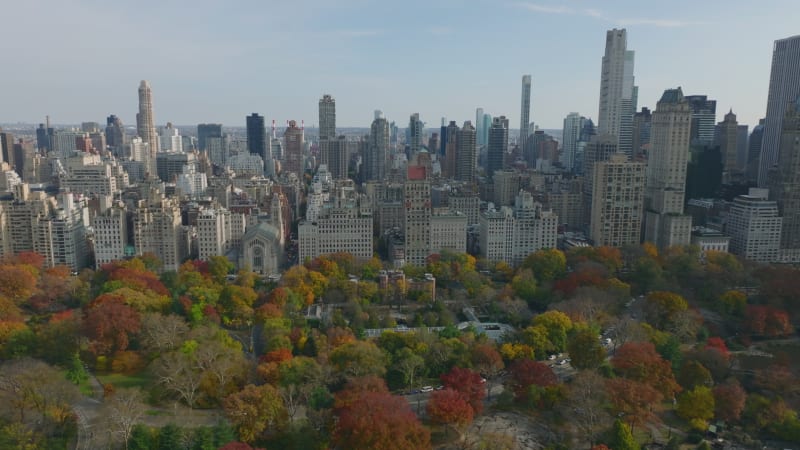 Aerial panoramic view of skyscrapers surrounding Central park. Colourful autumn foliage. Manhattan, New York City, USA