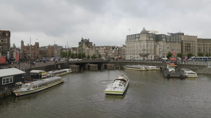 Overhead View of Amsterdam's Damrak Street on a Cloudy Day