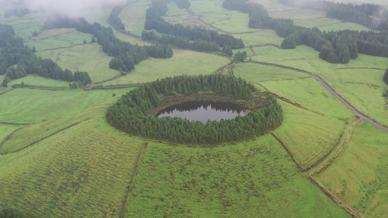 Aerial view of a small lake on hilltop near Capelas, Azores Islands, Portugal.