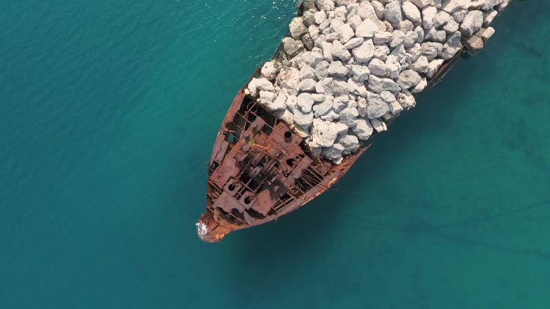 Aerial view of artificial pier with rusty ship bow, Nerezine.