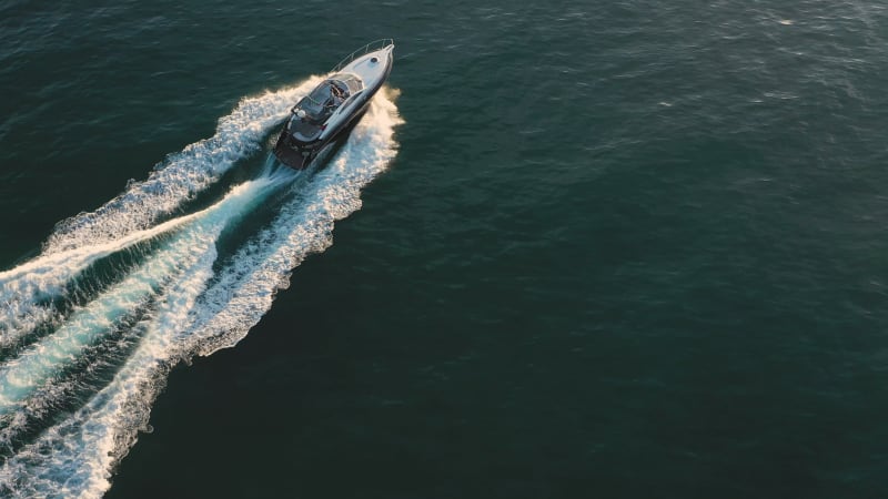 Scenic aerial view of speed boat crossing the mediterranean.