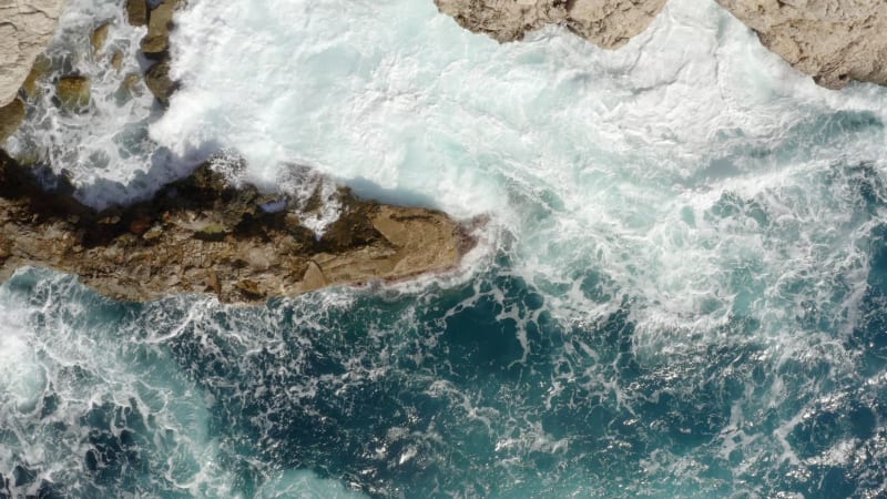 Birds View of beautiful Ocean Blue Water on Rock Coast crMavic 2 prohing on Tropical Island Mallorca, Spain Vacation, Travel, Sunny, Waves