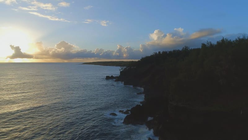 Sunrise Over A Beautiful Coastline with the Sun Rising Over the Sea