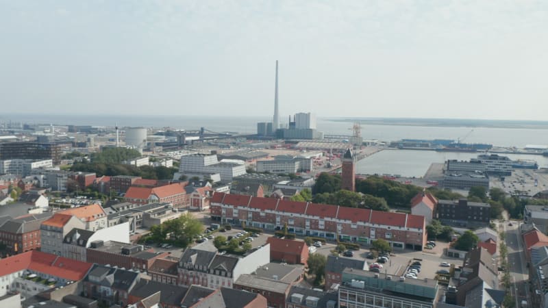 Aerial view over the city of Esbjerg with his harbor and the chimney of the coal and oil fueled power plant. This chimney is the tallest in all Scandinavia