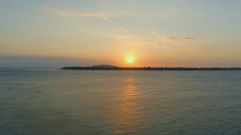 Rising Aerial View of the Gili Isles at Sunset