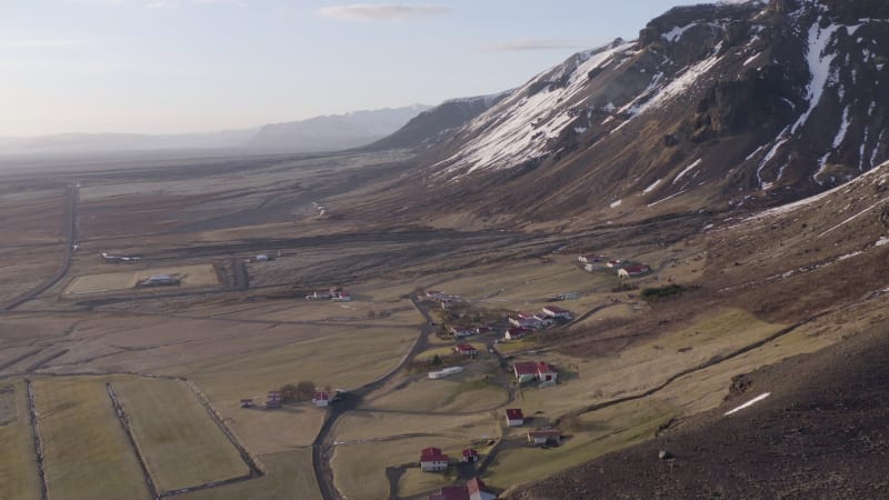 Small Secluded Farm Next to a Snowy Mountain in the Winter