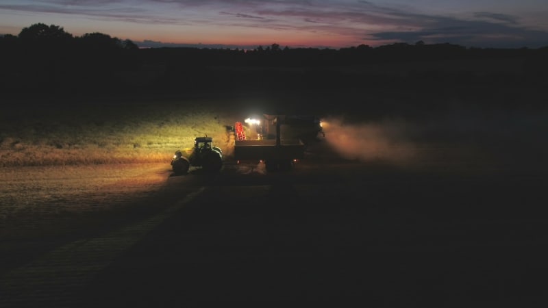 Combine Harvester at Night During the Harvest