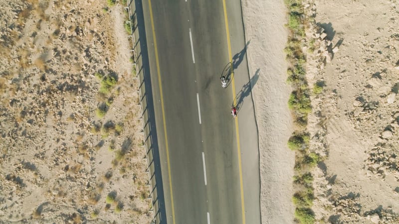 Aerial view of two person on bicycle, Mizpe Ramon, Israel.