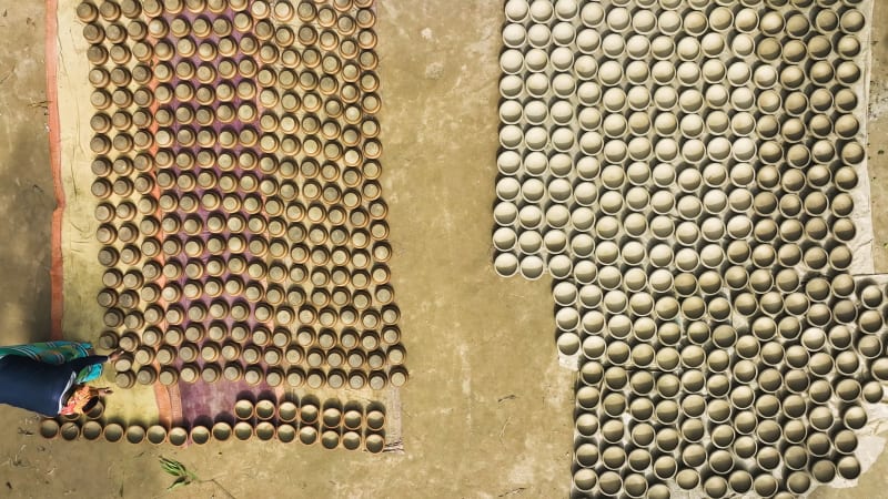 Aerial View of people working in a clay pot factory in Bogura, Bangladesh.