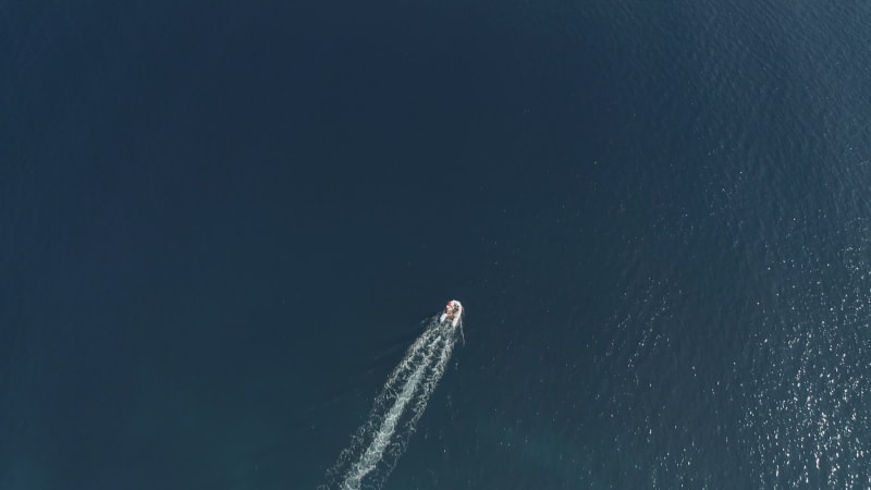 Aerial view of boat faraway in the mediterranean sea, Vathi.