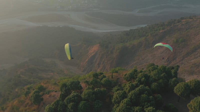 Aerial view of people doing parachuting in Poraia, India.