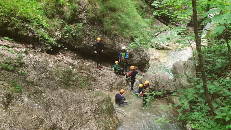 Aerial view of a group of people canyoning.