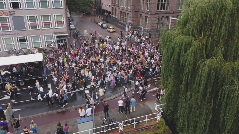 Protesters marching down a street during Unmute Us Campaign in Utrecht, Netherlands.