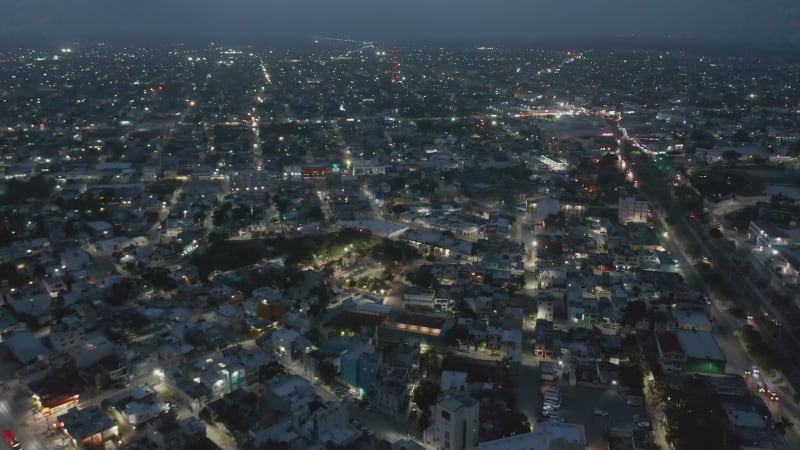 Aerial panoramic view of city after sunset. Tilt up reveal of evening sky with clouds.  Cancun, Mexico