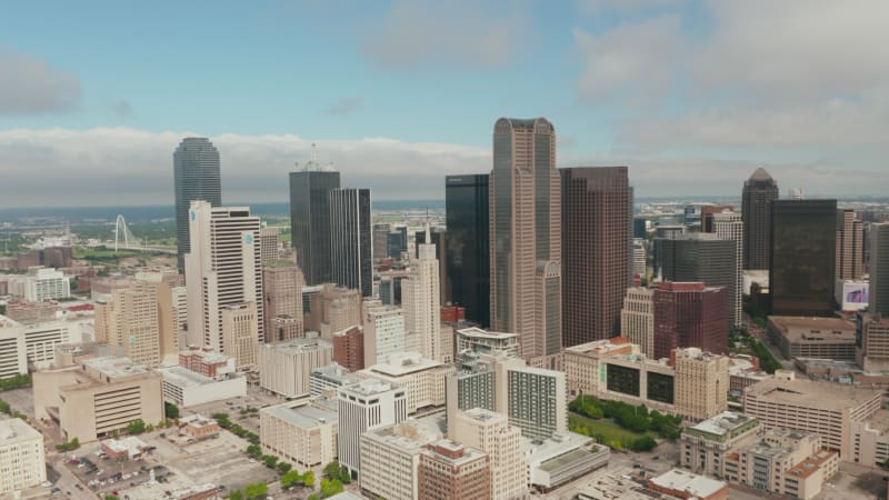 Aerial view tall modern office buildings downtown. Zooming out footage of skyscrapers group from drone. Dallas, Texas, US