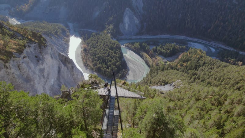 Hikers Looking from an Observation Deck Overlooking Ruinaulta in Switzerland