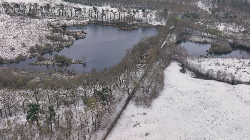 Aerial view of nature area Witte Veen with snow, Twente, Overijssel, Netherlands.