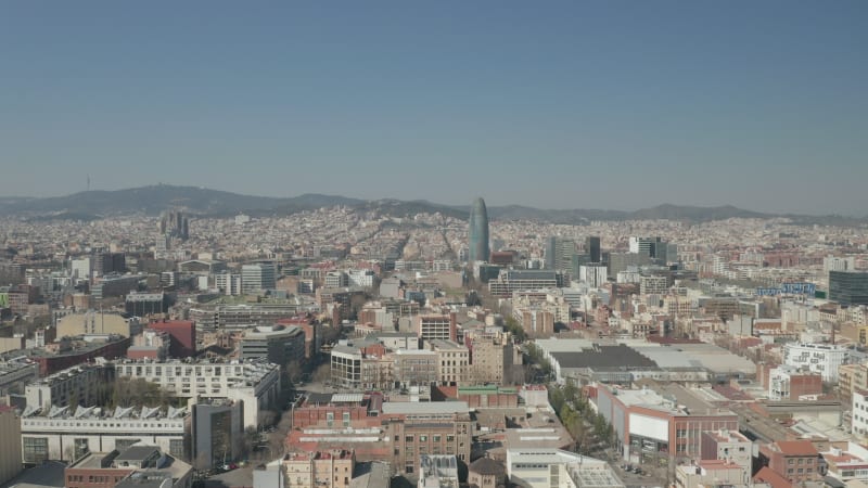 Barcelona Wide Drone Shot of City Towards Center with La Sagrada Familia and Torre Glories, Torre Agbar