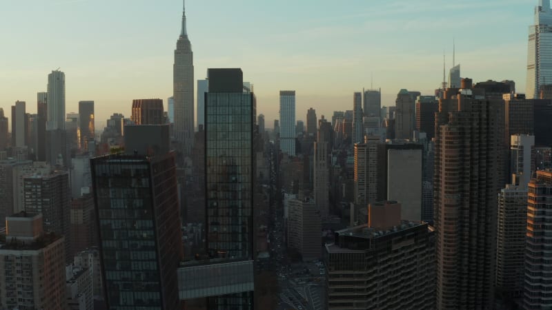 Elevated view of various high rise buildings in city at dusk. Skyscrapers against colourful sky. Manhattan, New York City, USA