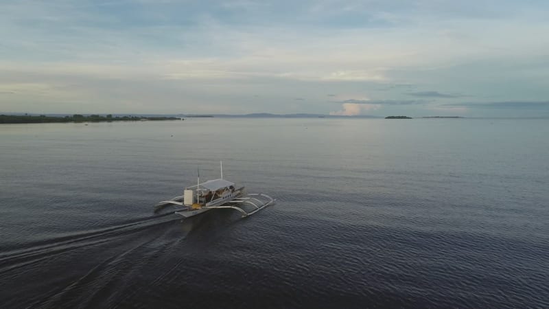 Aerial view of single filipino fishing boat near Lapu-Lapu city.