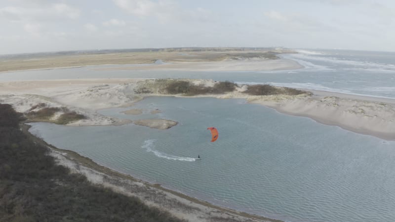 Arial view of a person doing windsurf in Retranchement, Netherlands.