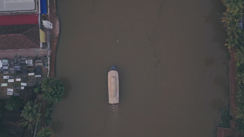 Overhead view of large houseboat sailing on the river in India