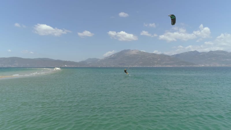 Aerial view of person kitesurfing.