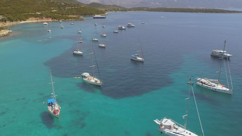 Aerial view of group of boats anchored in the mediterranean sea.