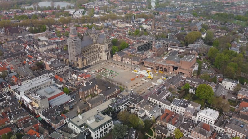 Pan out drone footage of St John's Cathedral in  's-Hertogenbosch, Netherlands and it's surrounding