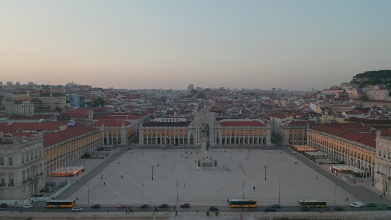 Aerial dolly in of Praca do comercio square with Arco da Rua Augusta building and monument on the coast of Lisbon city center