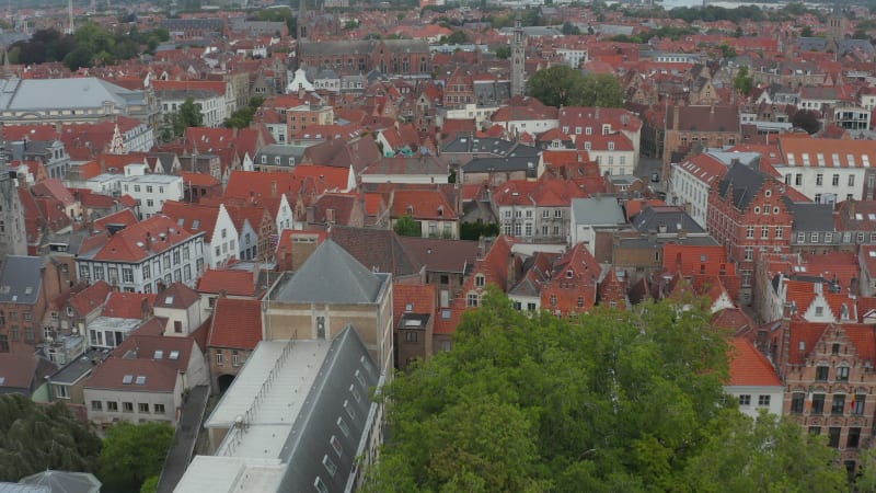 Cityscape over Bruges, Belgium with Red Rooftops with Churches from Aerial Perspective