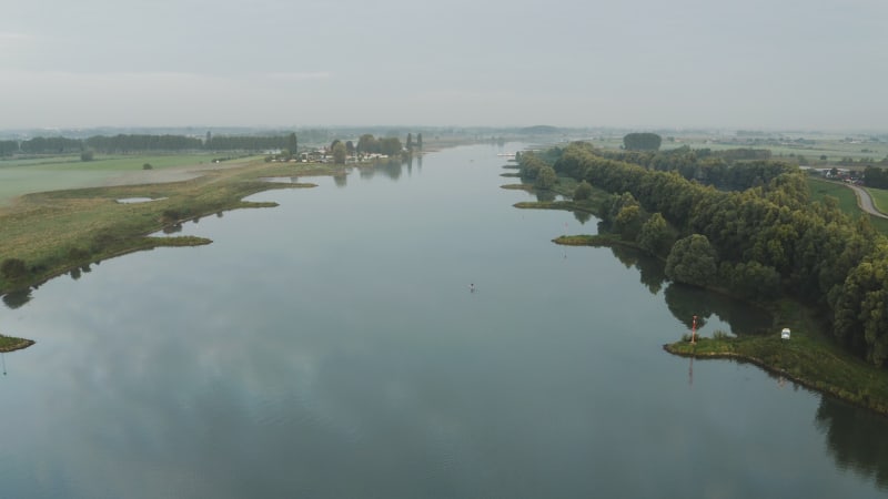 Fly Over View of a Stand Up Paddle Board in the Lek River, the Netherlands