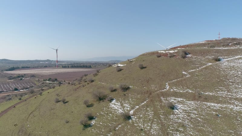 Aerial view of a valley with hills with wind turbines, Golan Heights, Israel.