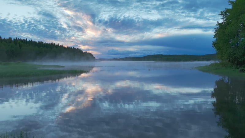 Aerial view of a lake at sunset in Overtornea, Sweden.