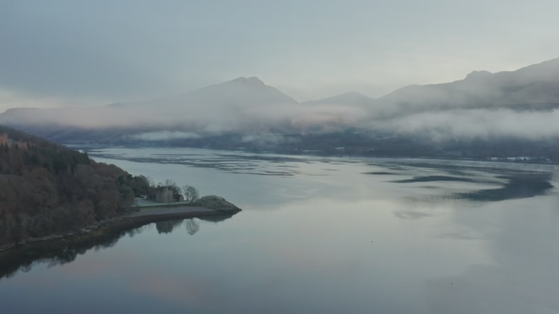 Fog over the sea loch near Dunderave Castle in Scotland