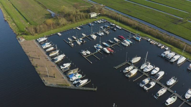 Aerial view of boats docked in a marina on a sunny day