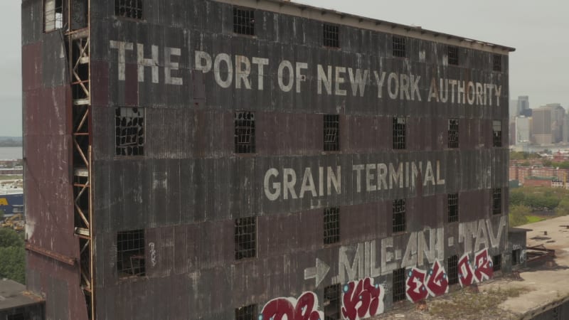 Towards Rusty old Cargo Warehouse in the Docks of New York City on a cloudy Grey day