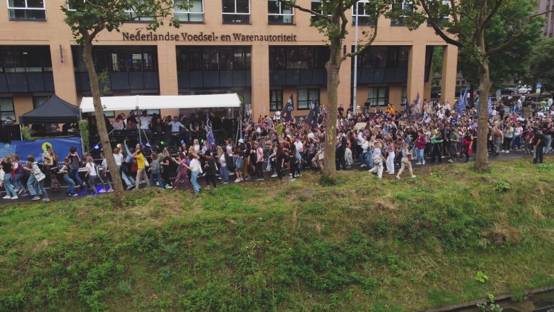 Protesters marching down a street during Unmute Us Campaign in Utrecht, Netherlands.