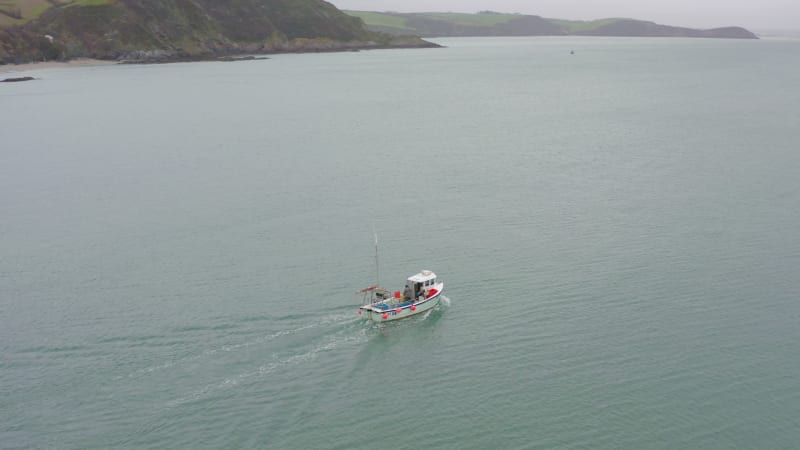 Fishing Boat Heading Out to Sea in Cornwall UK