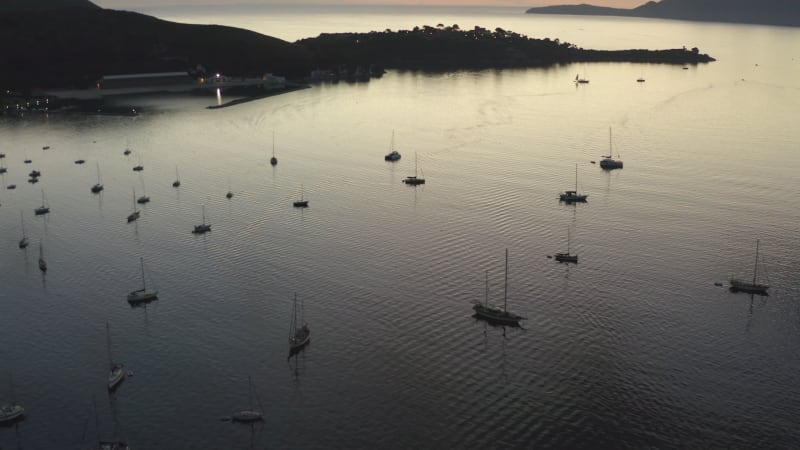 Ocean with Sailboats and Tropical Island with Mountains in Background at Sunrise Vacation, Travel, Sunset