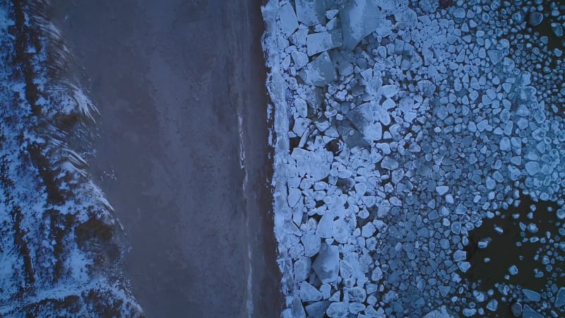 Aerial view of the frozen rocky sea on the coast of Muraste.