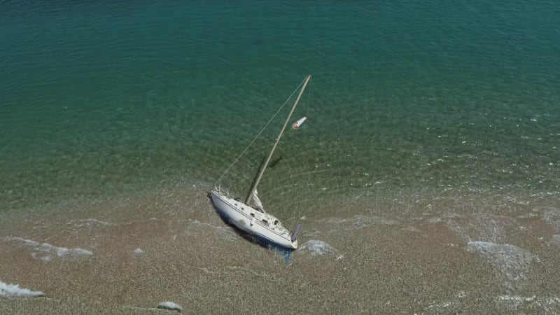 Aerial view of boat aground at sandbank.