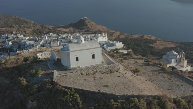 Church on top of the Hill with Greek Flag waving in wind Aerial Perspective