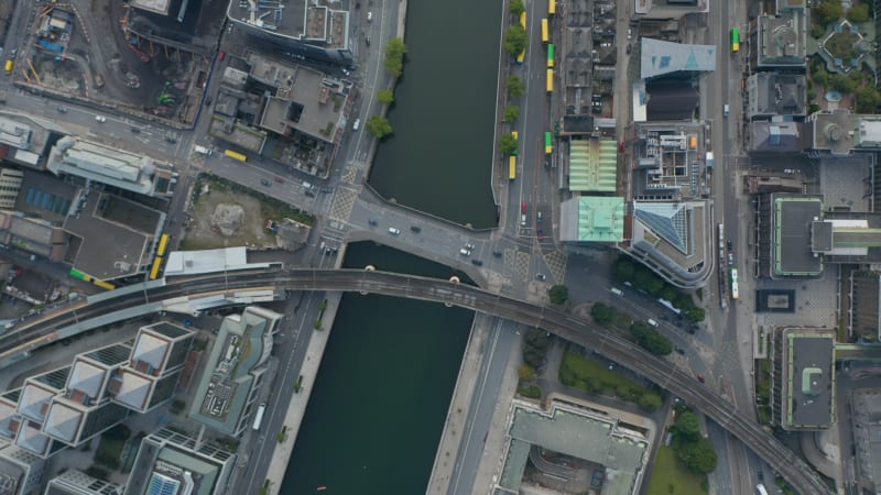 Aerial birds eye overhead top down view of traffic on bridge across Liffey river. Railway bridge next by. Dublin, Ireland