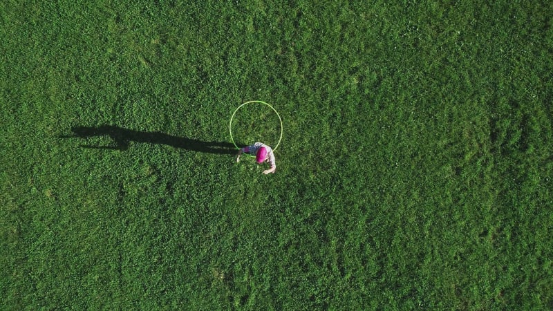 Aerial view of a woman with Hula Hoop in a park, Zagreb, Croatia.